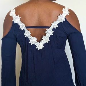 Navy blue, peek-a-boo shoulder shirt with floral white lace
